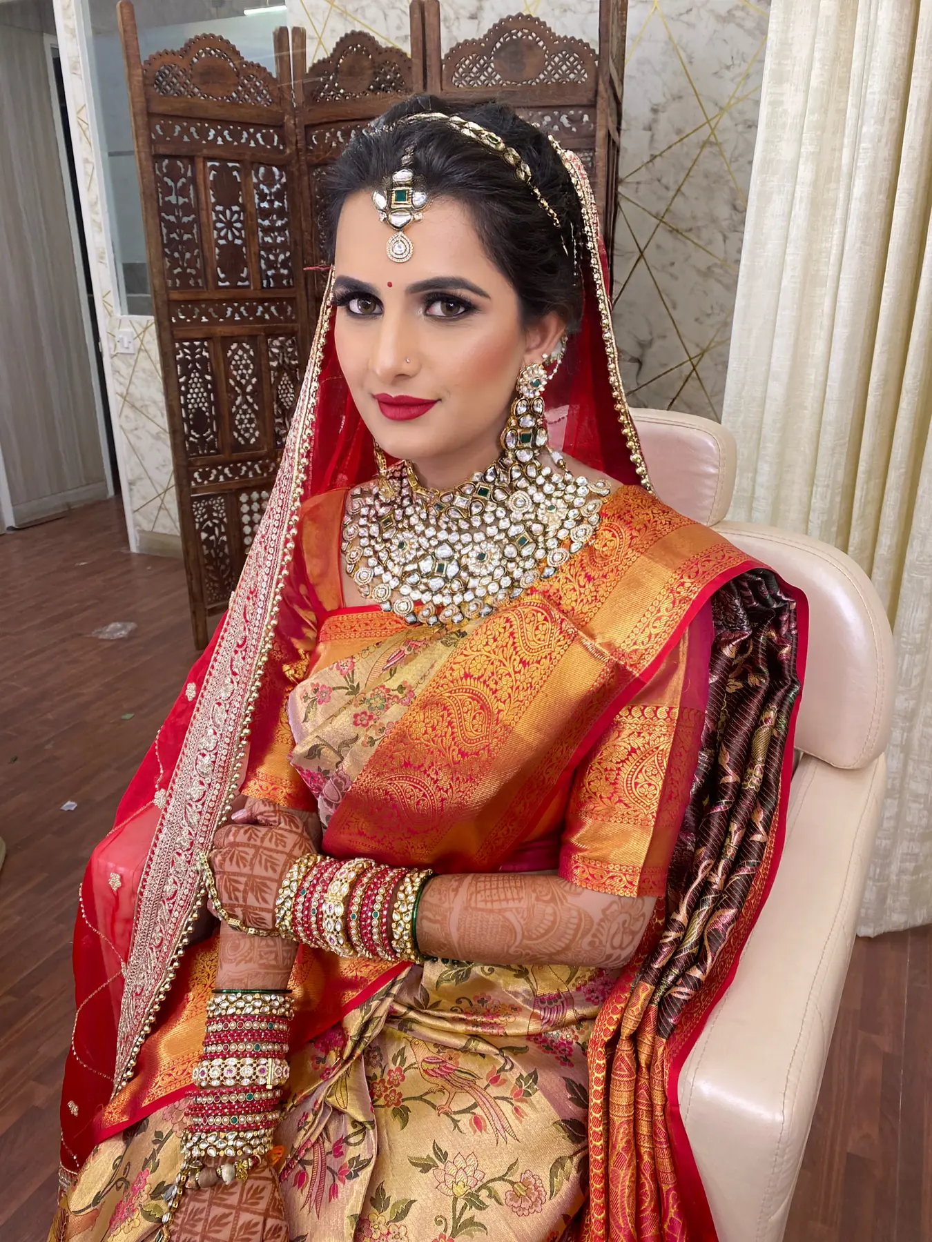 Red and Gold Saree, Temple Jewellery. Bridal makeup by Madhu Gupta at MG Makeovers, Gurugram